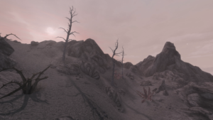 An in-game screenshot of an ash-covered hillside suffused in pink light, dotted with dead trees and dry scrubs